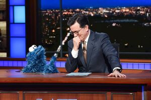 Cookie Monster and Stephen Colbert