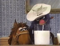 Marshal Grover drinks a biggest glass of milk in a Sesame Street sketch