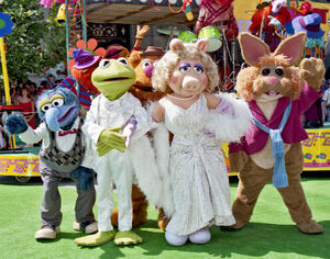 Kermit and the Muppets pose on the "green carpet" at the opening of Muppet*Vision 3D, 1991