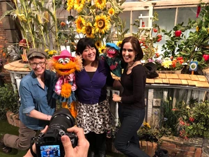 Harada on the Sesame Street set with her Avenue Q co-stars  and .