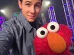 Nick Jonas and Elmo