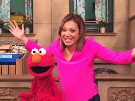 Zee on the Sesame Street set with Elmo