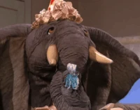 Horatio blows a birthday party favor in Sesame Street Episode 4034