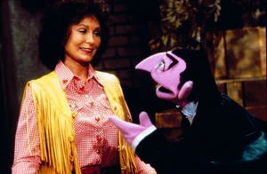 Lynn with Count von Count on Sesame Street