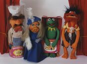 Swedish Chef, Miss Piggy in a blue dress, Kermit, and Animal
