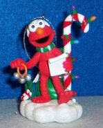 2009 Elmo caoling Elmo speaks, and sings "Jingle Bells" (battery operated)