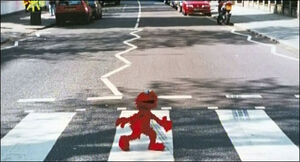 Elmo crossing Abbey Road.