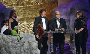 , Heather Chase, Kermit the Frog, David Gumpel, Michael Polis and Ritamarie Peruggi.