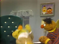 Bert slipping on Ernie's skate in a season 12 insert.