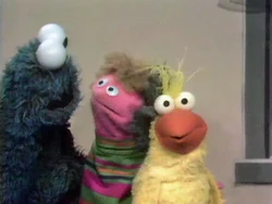 Little Bird next to Cookie Monster