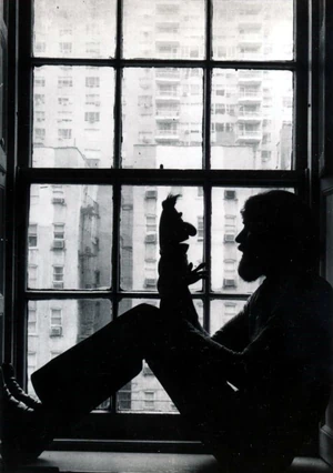 Jim Henson contemplates a Bert toy.