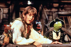 Jim Hawkins with Rizzo, Gonzo, and Captain Smollett