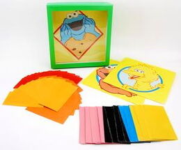 Fuzzy Friends Tissue Art A set of shadowbox frames, colored tissue paper and self-sticking cards with pictures of Big Bird, Cookie Monster and Elmo. The materials can be used to make three-dimensional shadow box pictures of the Sesame friends.