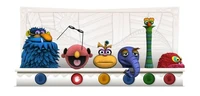 GoogleDoodle-JimHenson's75th-(2011-09-24)-PinkPuppetGlasses.jpg (45 KB) The pink puppet tossing up his glasses.