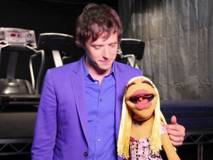 Janice with Damian Kulash on the set of 's "Muppet Show Theme" music video.