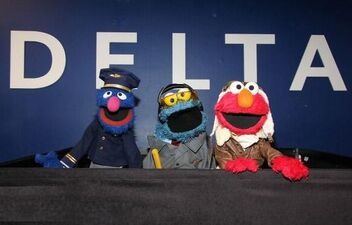 Elmo, Cookie Monster, and Grover at LaGuardia Airport on May 3, 2011.