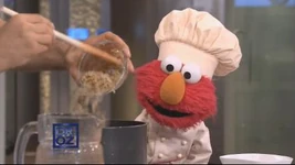 Dr. Oz cooking with Elmo.