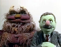 Mmf-teaser.jpg (30 KB) Luncheon Counter Monster muscles Gimley's Boss to finish his sales pitch