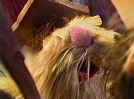 caveman instructor in "Great Moments in Business History"