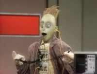 Digit in his alternate gray suit covered with numbers.