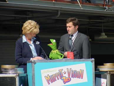 Cynthia Harriss (then-president of the Disneyland Resort), Kermit the Frog, and Charles Rivkin at the official opening of Muppet*Vision 3D.