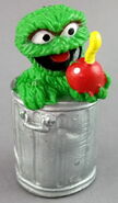 Oscar the Grouch with an apple