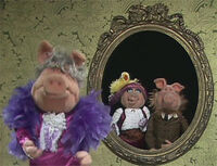 A family of pigs performing "The Bird on Nellie's Hat"