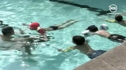 BoyParticipatinginhisSwimmingClass
