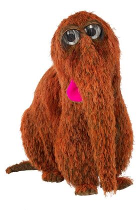 brown witg muppet long nose