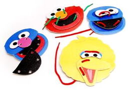 Lace n Create Set 12 lacing cards can be sewn together to make the faces of Elmo, Cookie Monster, Big Bird and Grover.