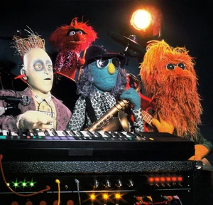 Digit (left) and Beard (right) with Animal and Zoot (center)