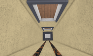 The elevator shaft.
