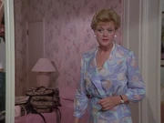 Someone from the crew can be seen in the reflection of the mirror in one scene