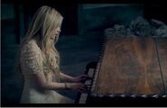 Avril playing piano in When You're Gone video