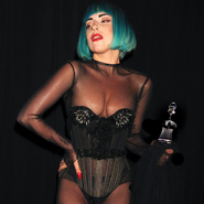 Lady Gaga holding her Fashion Icon Award at the 2011 CFDA Fashion Awards