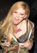 Avril wearing a spiked bra