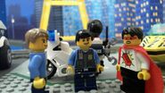 Legoman, Chase McCain, and Officer Max explore the cargo train depot.