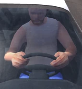 Driver of the white Victra, holding wheel fearfully