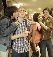 Ethan's actor, Matthew Knight, kissing Rory's actor, Cameron Kennedy, on the cheek