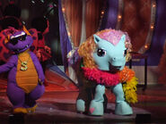 Rainbow Dash (right) with Spike in "My Little Pony Live: The World's Biggest Tea Party".