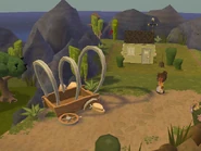 Roxie sweeping outside her house in MySims Kingdom.