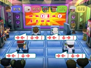 Rob hosting the "King of the Combo" minigame in MySims Party (Wii).
