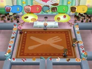 Edwin hosting the "Yummy in My Tummy" minigame in MySims Party (Wii).
