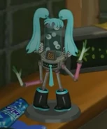 A Blipsqueak figurine in a Hatsune Miku cosplay in the 4.8 trailer