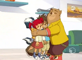 Grizz gives Alfred, Milo and Camile a bear hug.