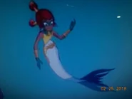 As a mermaid.