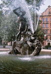 A statue depicts the fight between Þórr and Jörmungandr in Stockholm, Sweden.