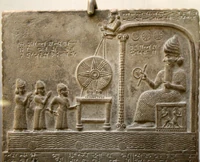 A meeting of gods on the Tablet of Shamash, British Library room 55. Found in Sippar (Tell Abu Habbah), in Ancient Babylonia ; it dates from the 9th century BC and shows the sun god Shamash on the throne, in front of the Babylonian king Nabu-apla-iddina (888-855 BC) between two interceding deities. The text tells how the king made a new cultic statue for the god and gave privileges to his temple.