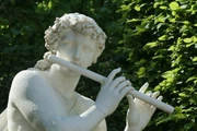 Acis playing the flute.