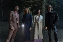 Nick, Nancy, Bess, and Ace investigating at night